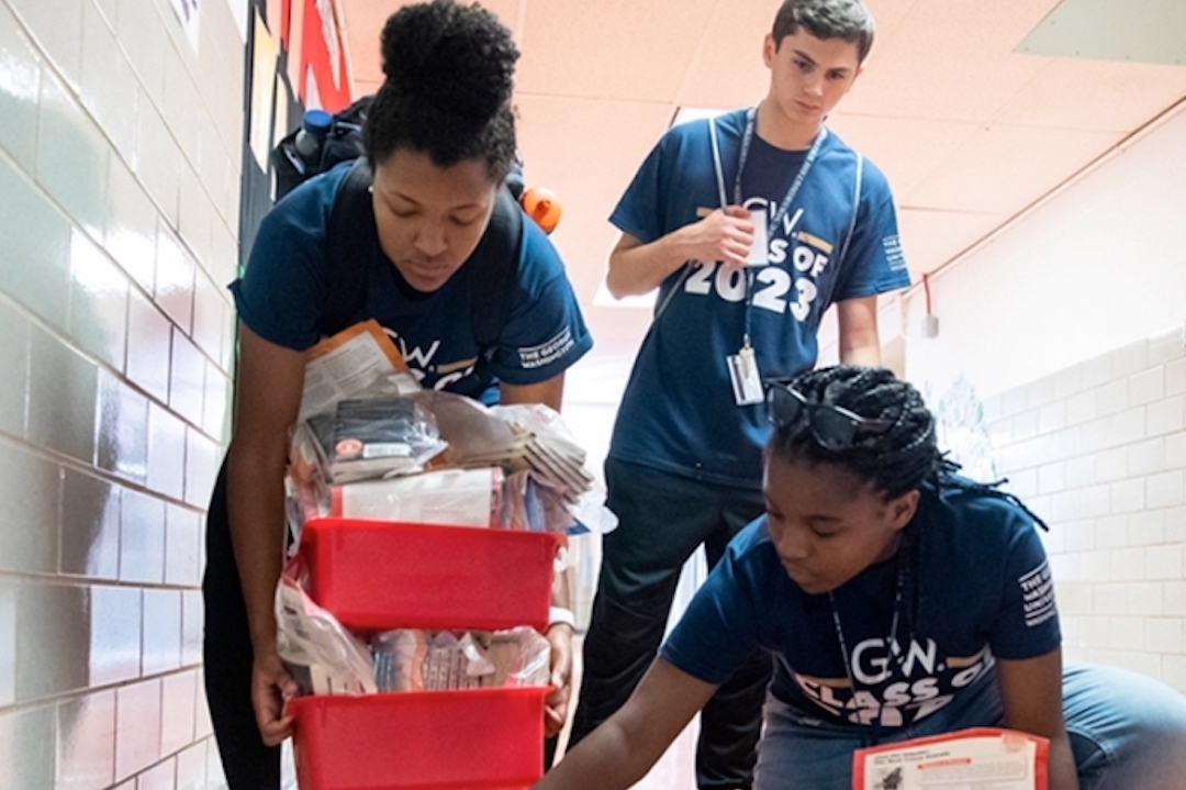 Three students volunteer at Welcome Day of Service event